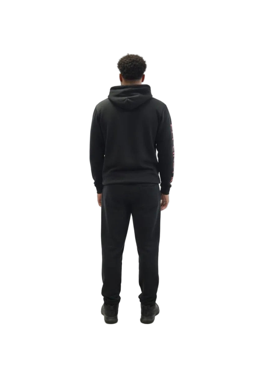 Person wearing a black hoodie and pants on a white background