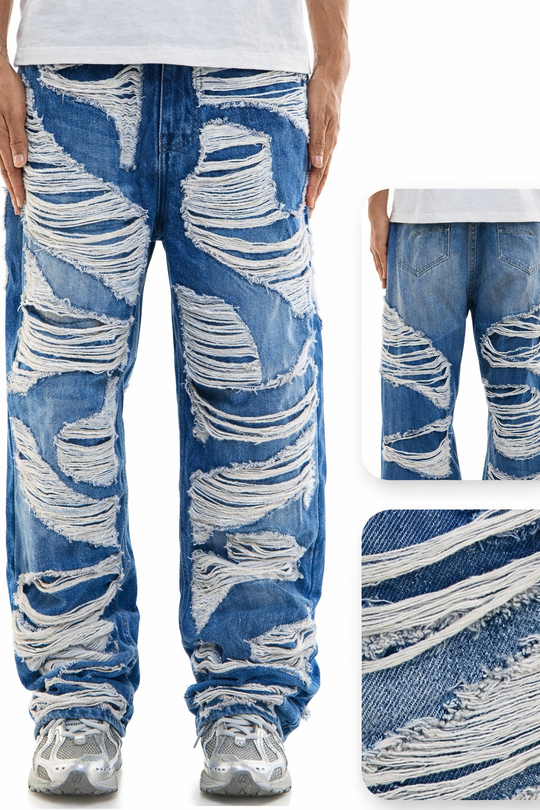 Distressed blue jeans with white wear and tear on a white background