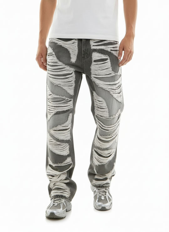 Person wearing gray camouflage pants on a white background