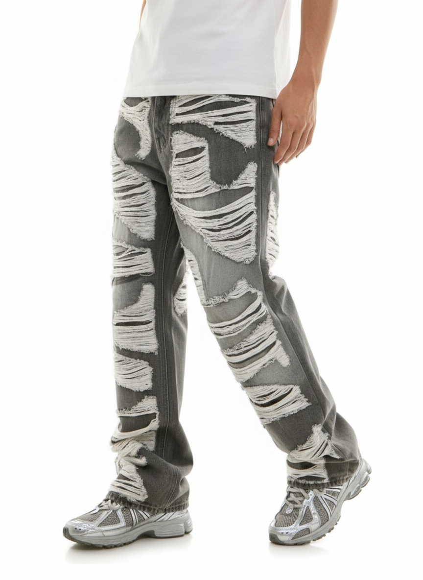 Person wearing gray patterned pants on a white background