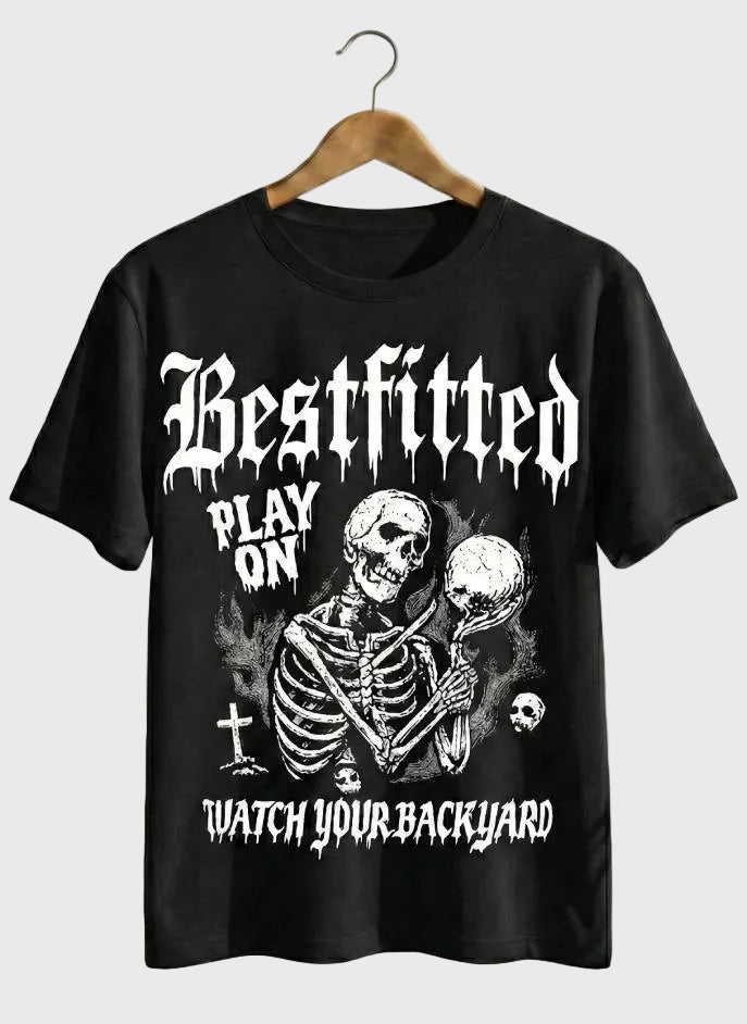 Black t-shirt with a skeleton graphic and text on a hanger against a white background