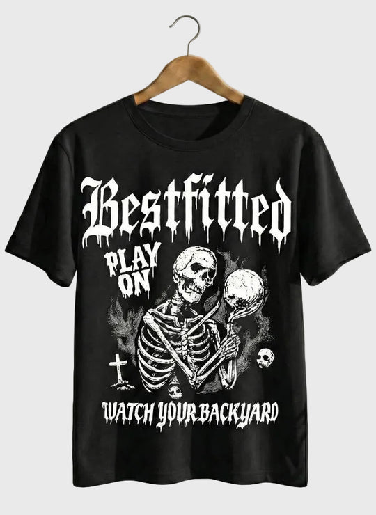 Black t-shirt with a skeleton graphic and text on a hanger against a white background