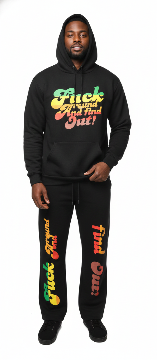Person wearing a black hoodie and pants with colorful text on a white background