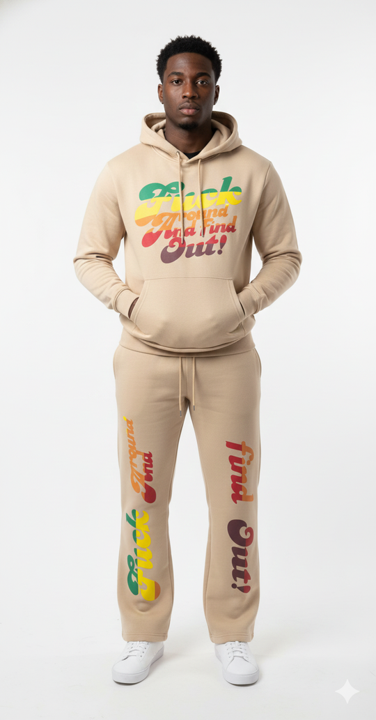 Person wearing a beige tracksuit with colorful text on a white background