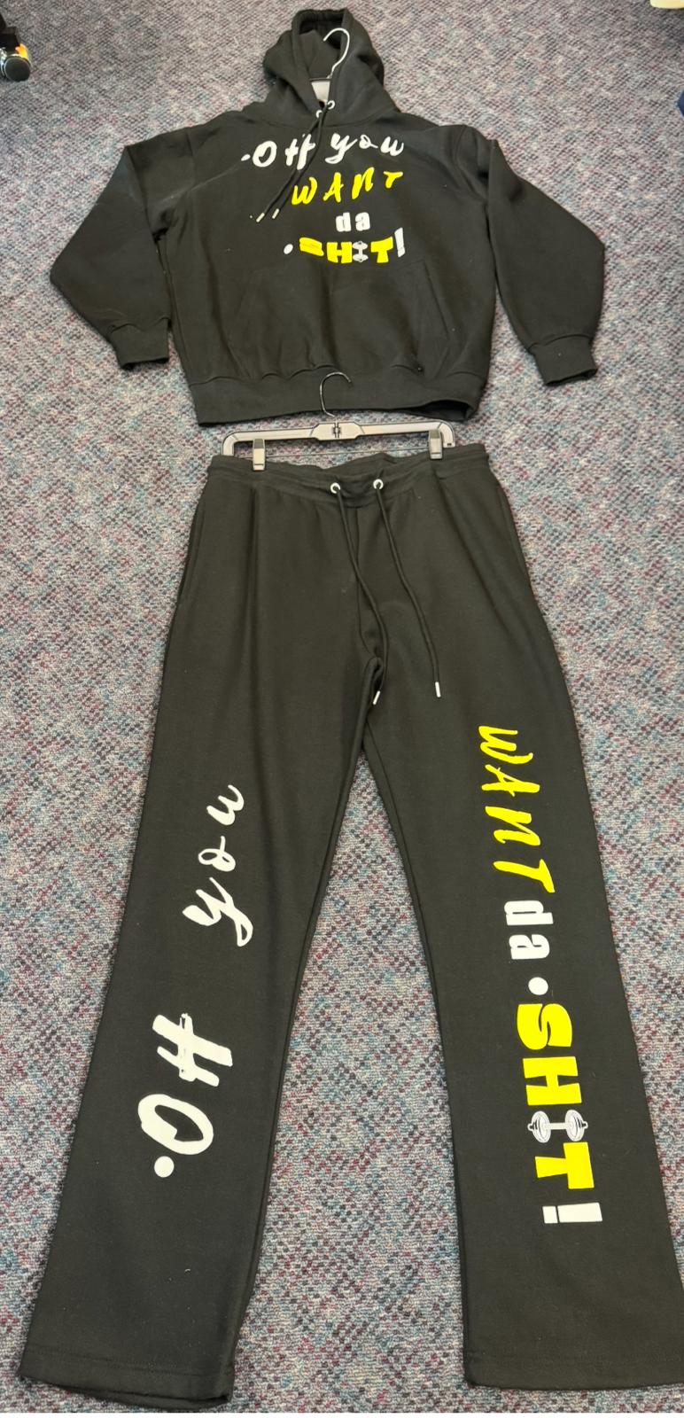 Black hoodie and pants set with text on a textured surface