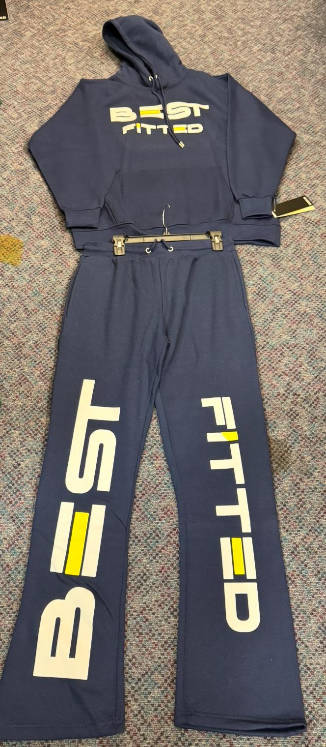 Navy tracksuit with 'BEST FITTED' text on a textured surface