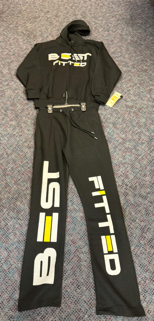 Black racing suit with 'BEST FITTED' branding on a textured surface