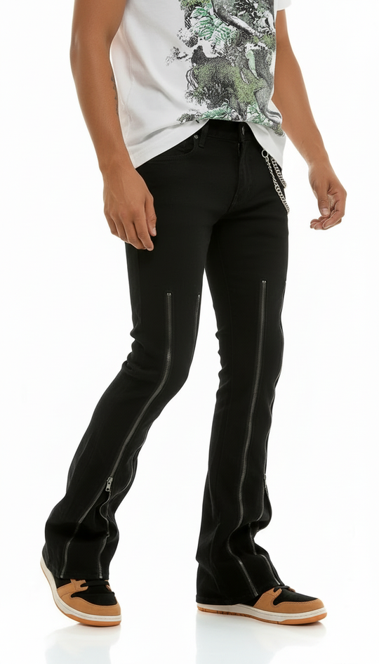 Person wearing black pants and a white shirt with green design on a white background