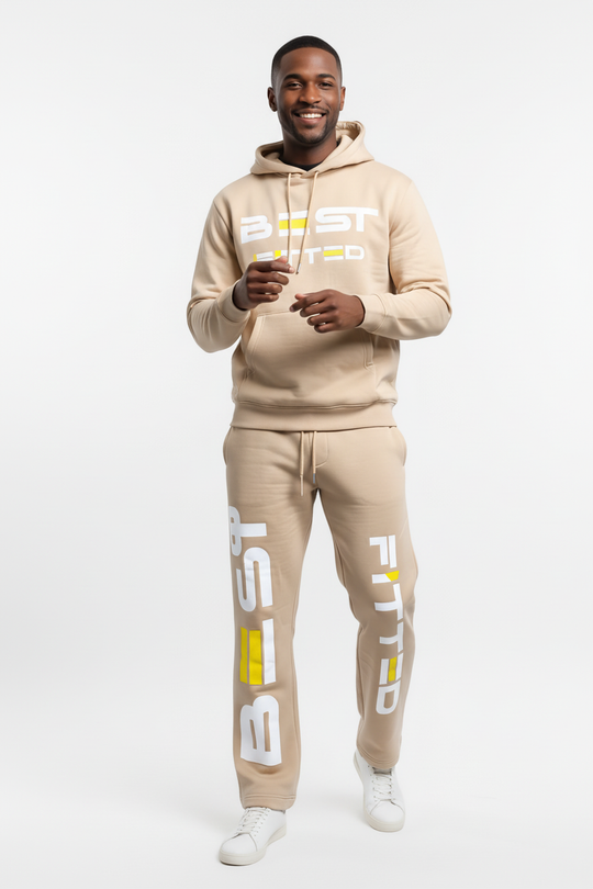Man wearing a beige hoodie and jogger set with 'BEST FITTED' branding on a white background