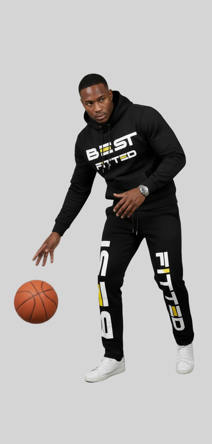 Person wearing a black 'BEST FITTED' hoodie and pants with a basketball on a gray background