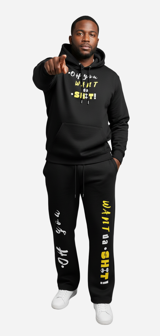 Man wearing a black hoodie and pants with text, pointing forward on a gray background