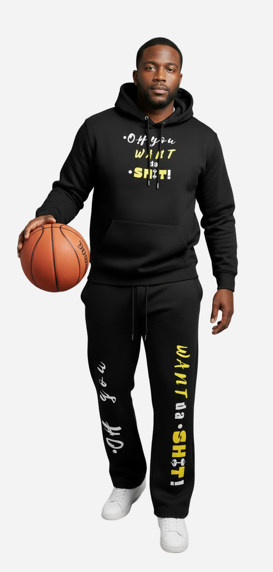 Person wearing a black hoodie and pants with text, holding a basketball on a gray background
