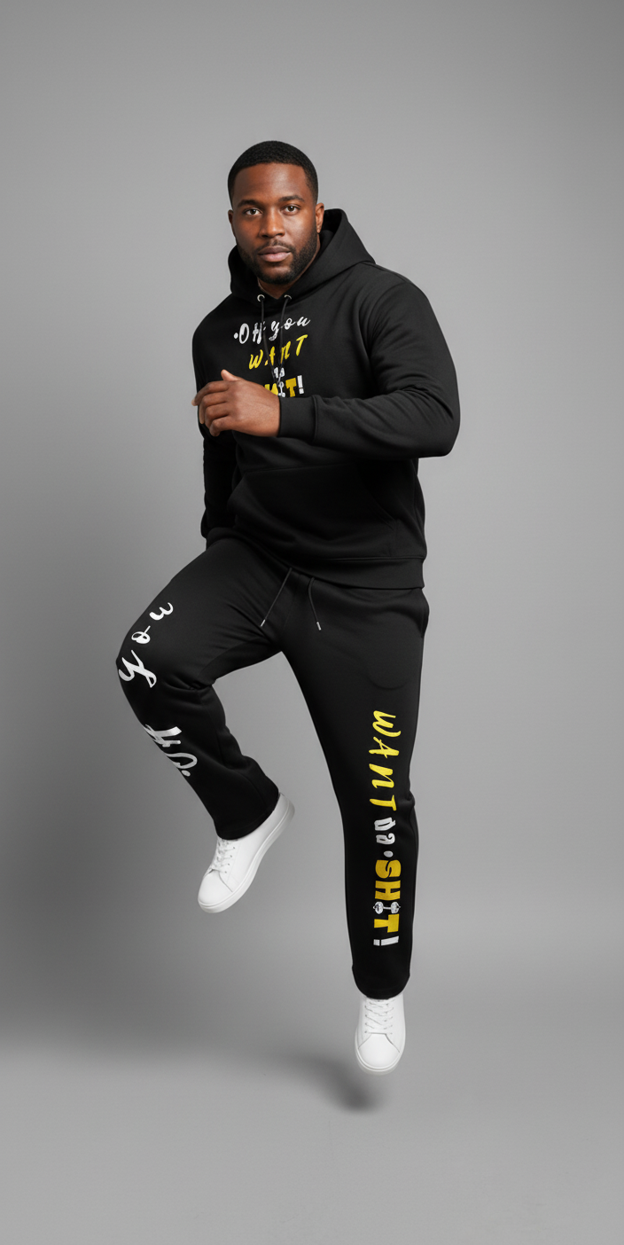 Man wearing a black hoodie and jogger set with yellow text on a gray background
