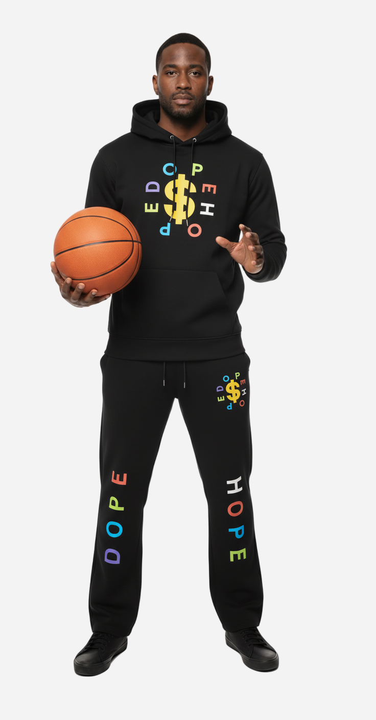 Person wearing a black hoodie and pants with colorful text, holding a basketball on a white background
