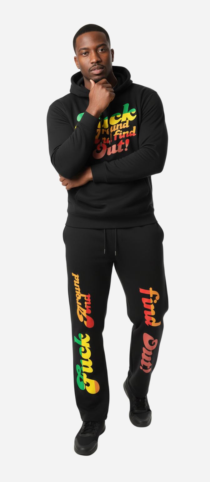 Person wearing a black tracksuit with colorful text on a white background