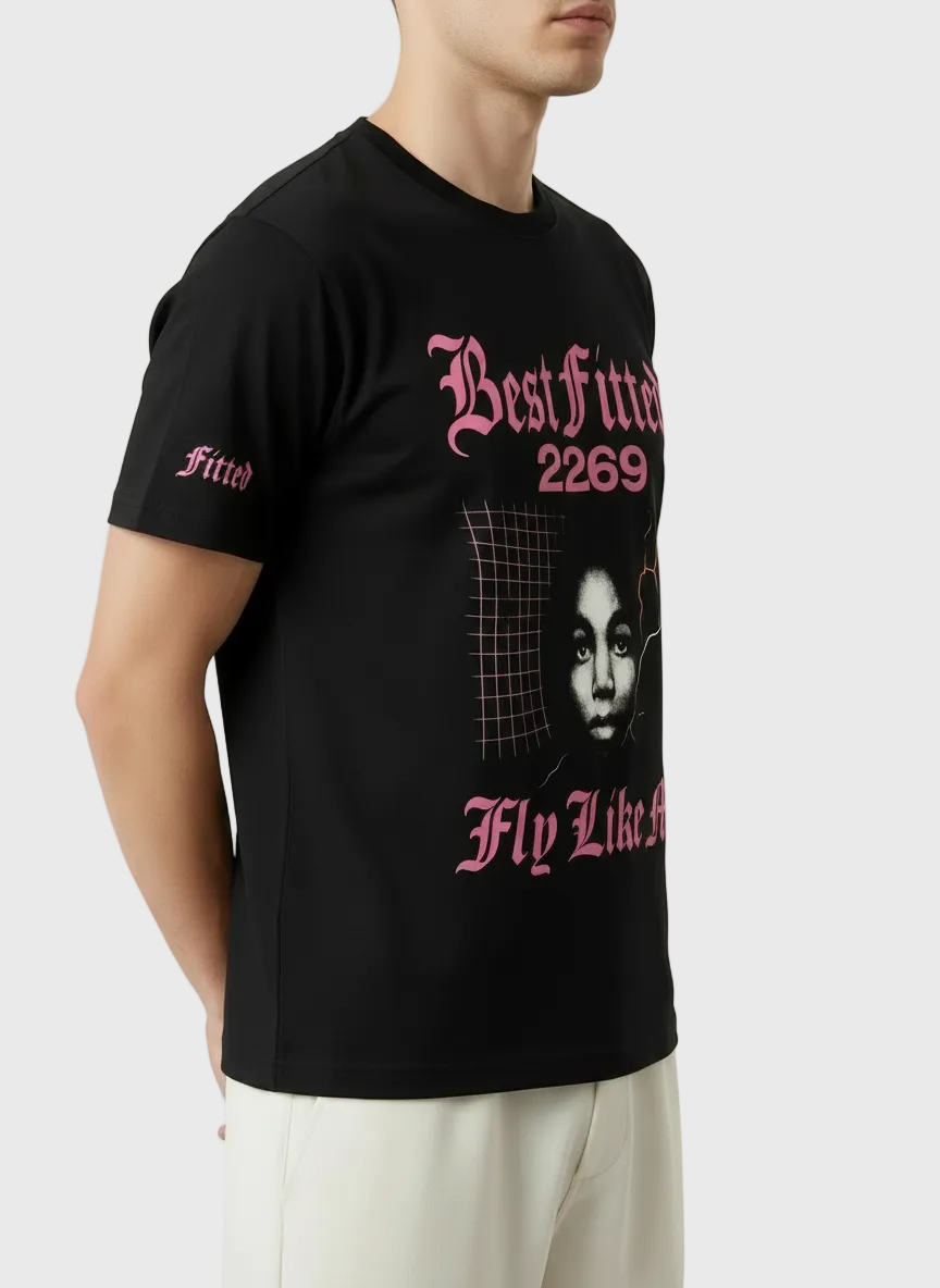 Person wearing a black t-shirt with pink text and graphics on a white background
