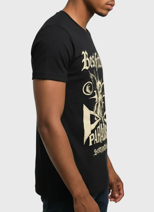 Person wearing a black t-shirt with gold graphic design on a plain background