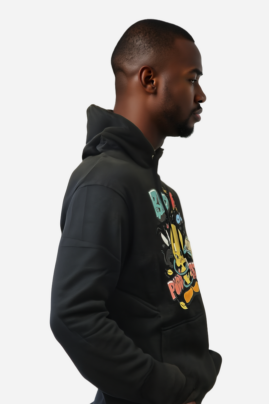 Man wearing a black hoodie with colorful text design on a white background