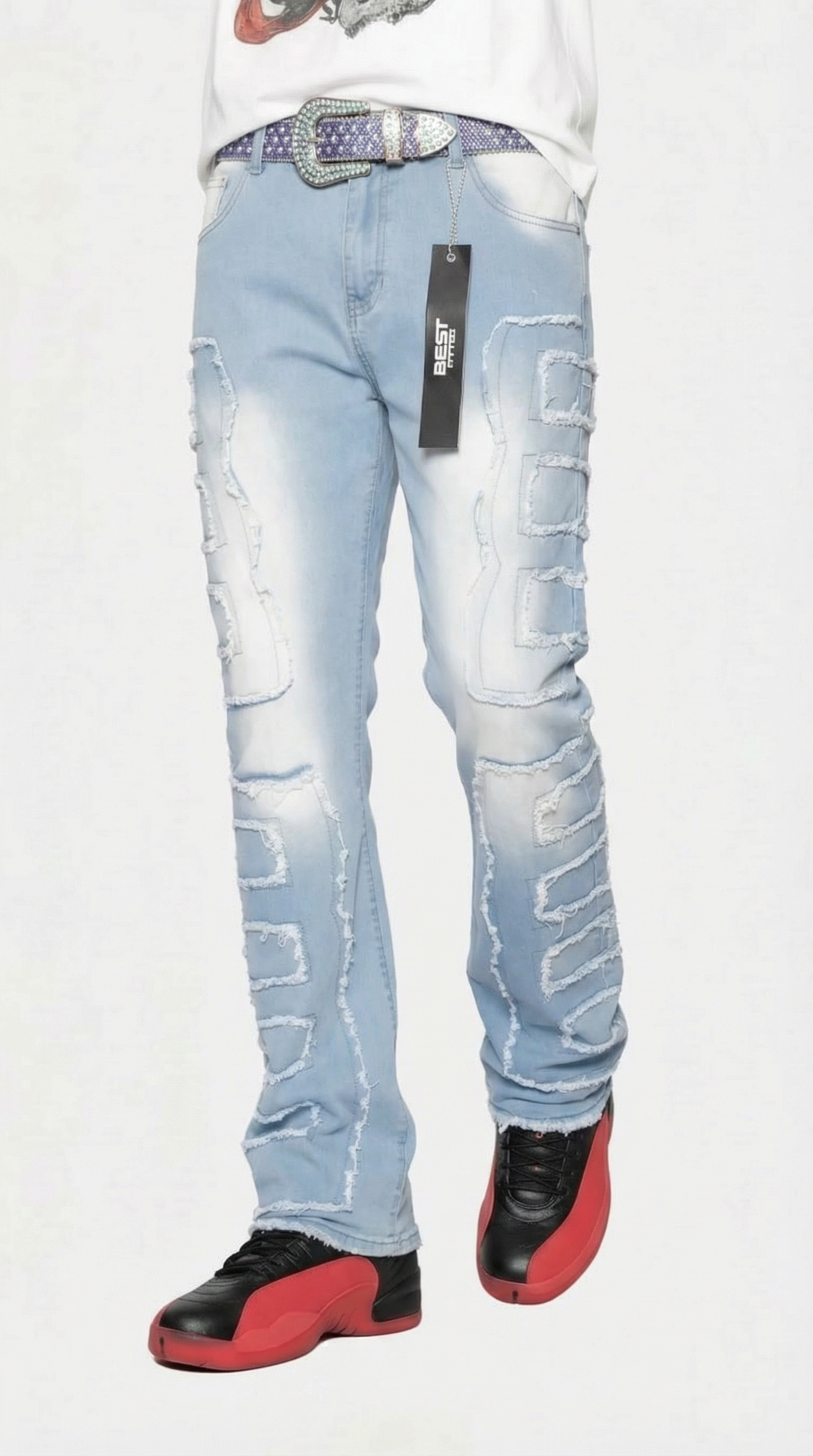 Light blue jeans with a brand label, worn by a person, on a white background