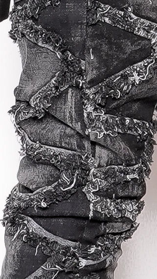 Close-up of a textured fabric with floral patterns on a white background